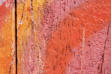 Vibrant background texture of wooden boards with strokes of paint