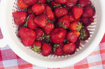strawberries in colander