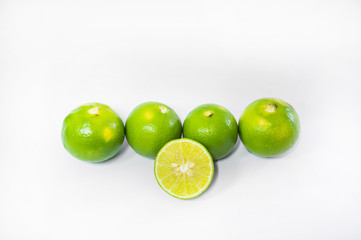 Green Lemons isolated on white background
