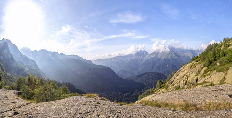 Fototapeta premium Panorama of a mountain valley with hills a sunny day in Abkhazia