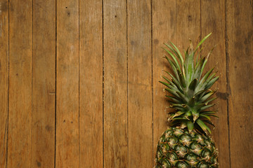 pineapple on the wood texture background