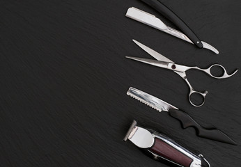 Barber shop tools on Black with place for text.