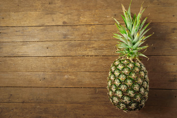 pineapple on the wood texture background