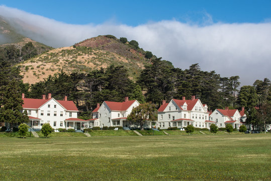 Fort Baker buildings under hill with fog