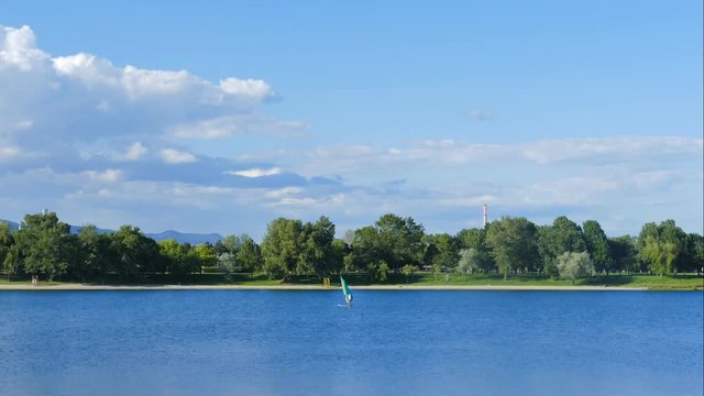 The lake and the panorama of the city with views of the hills in the background.