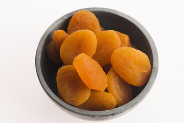 Delicious dried apricots in a bowl