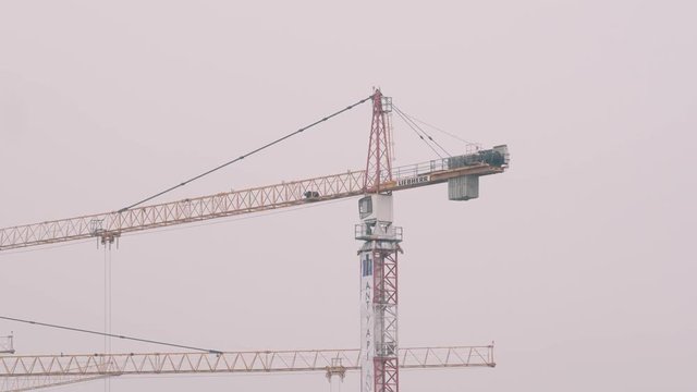 Constructuon crane in fog, rainy wheather