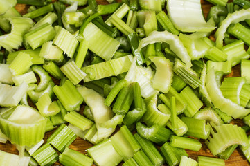 Sliced celery on the wooden board. Sliced celery, food background.
