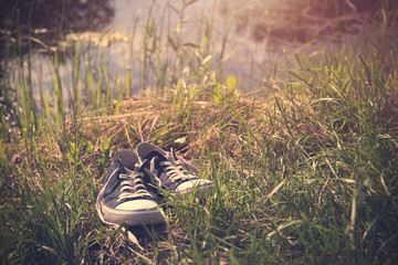 Vintage photo of sneakers in grass
