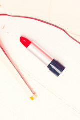 Red lipstick with high heel shoes