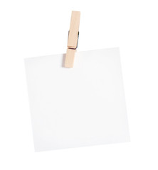 Wooden clothespin / Wooden clothespin and blank paper on white background.