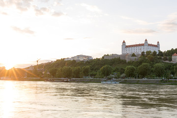Naklejka na ściany i meble Bratislava castle,parliament and Danube river just before sunset, Slovakia