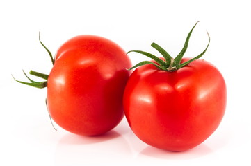 
Red tomatoes isolated on a white background.
