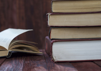 Old books on a wooden shelf