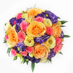 colorful rose bouquet with golden wedding rings 