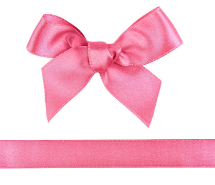 Pink satin bow and ribbon isolated on white
