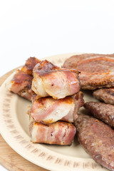 Served grilled meat on the plate over white background