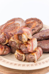 Served grilled meat on the plate over white background