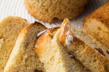 Homemade carrot muffin with empty space on white fabric background. top view