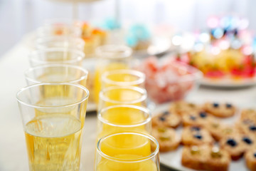 Set of cold snacks, canape, beverages and dessert, closeup
