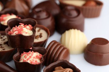 Obraz na płótnie Canvas Assorted chocolate candies, close up