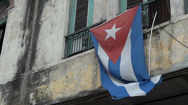 Cuban flag attached on old building in old Havana.
