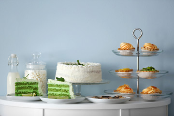 Different delicious desserts on table