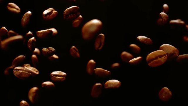 Coffee beans are flying in the air, black  background