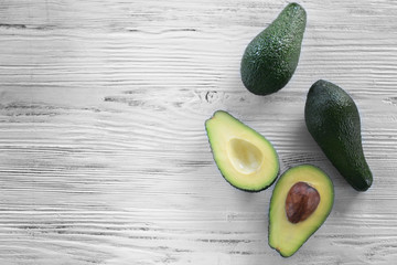 Fresh avocado on wooden background