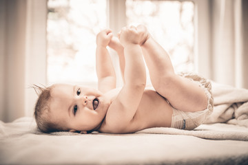 Little baby girl lying on her back 