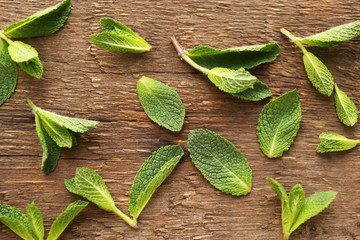 Fresh mint leaves on wooden background