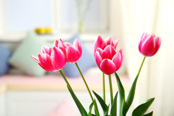Tulips in a vase in living room