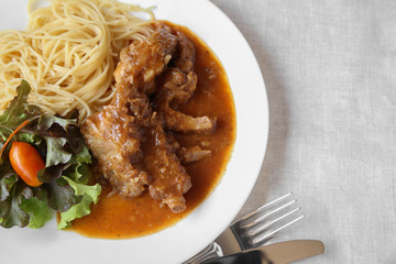 homemade slow cooked spared rib with spaghetti and salad