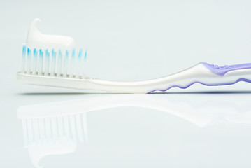 close up of tooth paste on brush