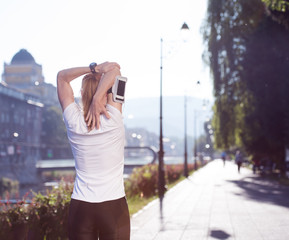 blonde woman  stretching before morning jogging