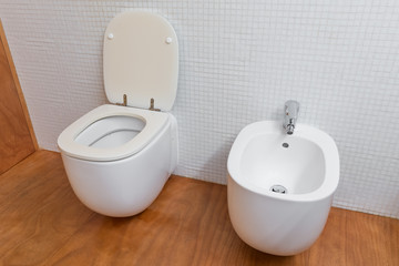 white toilet and bidet closeup