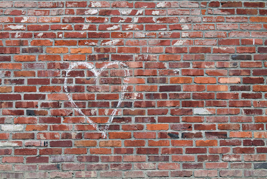 White Chalk Heart on a Red Brick Wall