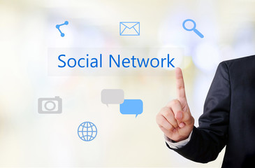 Businessman hand touch social network icon