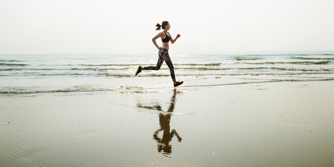 Fototapeta na wymiar Run Sea Sand Sport Sprint Relax Exercise Beach Concept