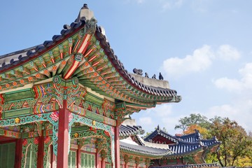 Korean traditional architecture. Roof detail of palace in Seoul. These places are major tourist attraction of South Korea.