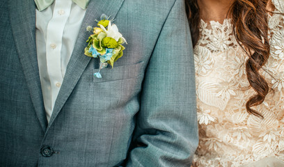 Groom suit and white bride dress.