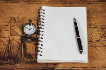 Antique watch on book wooden background.Vintage style.