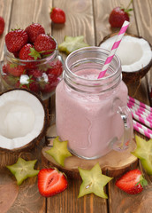 Refreshing cocktail with coconut milk and strawberries