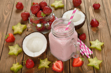 Refreshing cocktail with coconut milk and strawberries