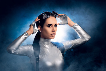 Woman in Silver Costume and Steampunk Glasses