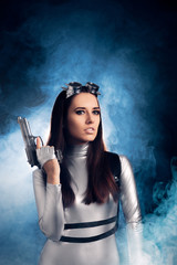 Woman in Silver Space Costume Holding Pistol Gun