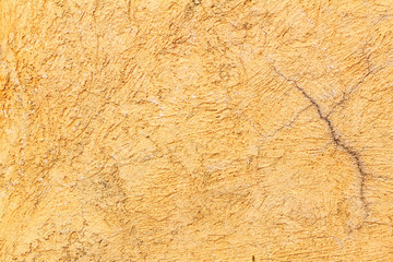 Abstract background texture cement wall in  orange yellow tone. Grunge wall texture. Cement texture and background with copy space for text or image.