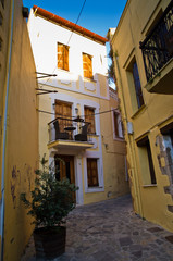 Fototapeta na wymiar One of the narrow streets at old medieval city and harbor Rethymno, Crete, Greece