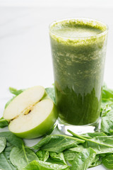 glass of fresh green spinach and kale healthy smoothie