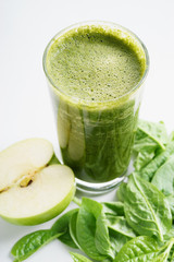 glass of fresh green spinach and kale healthy smoothie